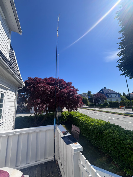 A homebrew Slim Jim antenna attached to a 6m fishing pole from Biltema.